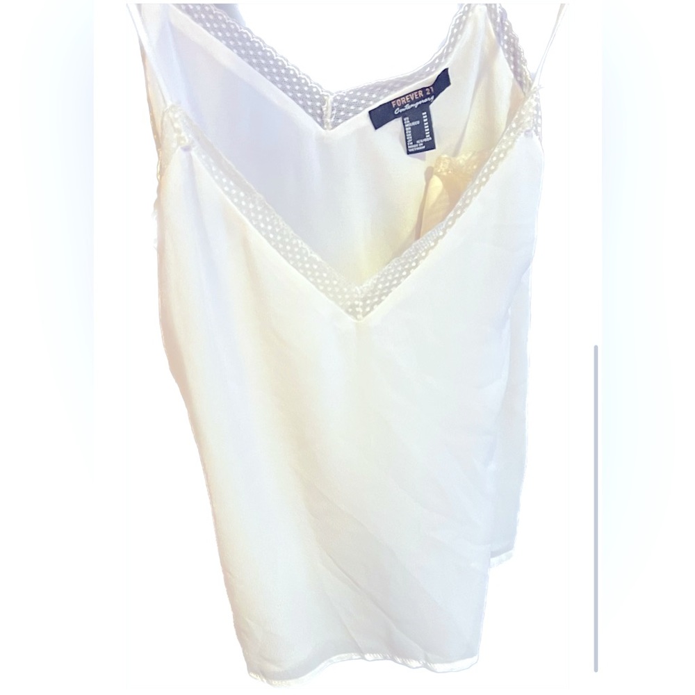 A white satin like tank top with beautiful lace detail- flowey and so pretty